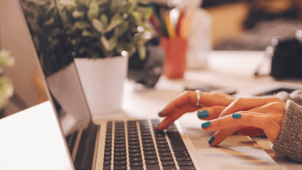 Woman Typing On Computer